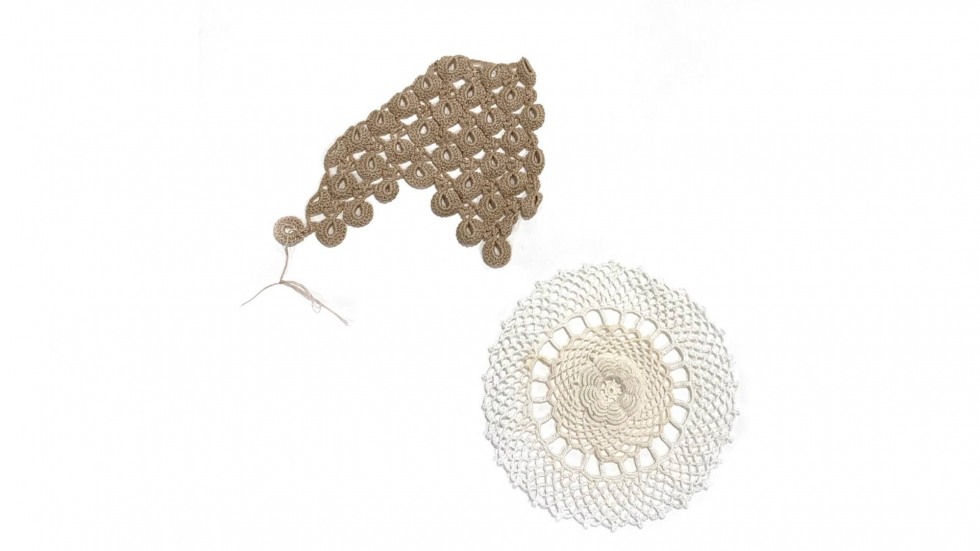 Two close-up samples of crochet work; on the top left is an unfinished scallop style, the bottom left is a rosette doily 